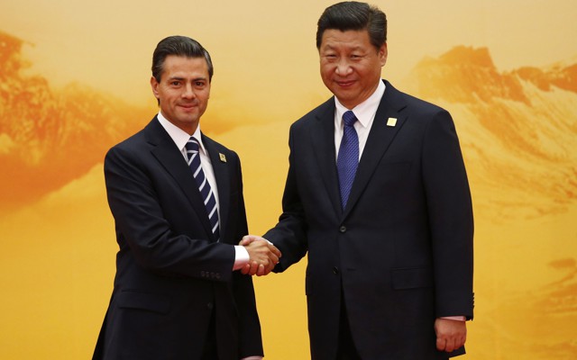 Mexico's President Nieto shakes hands with China's President Jinping.