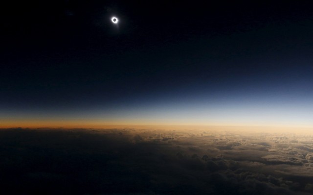 A total solar eclipse as seen from the window of a plane