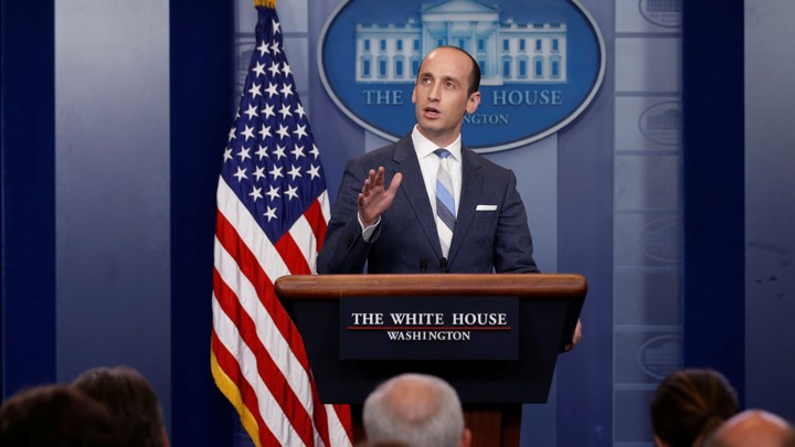 Stephen Miller speaks at a podium.