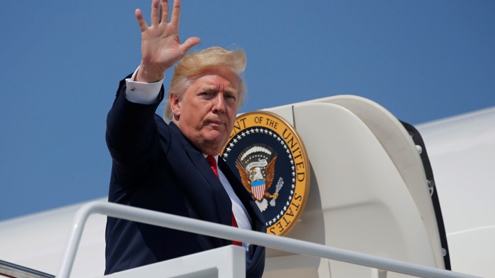 Donald Trump boards a plane to New Jersey.