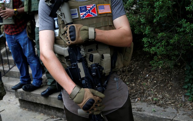 A member of a militia stands near a rally in Charlottesville, Virginia, August 12, 2017. 