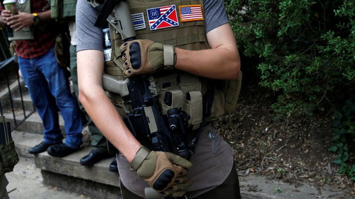 A member of a militia stands near a rally in Charlottesville, Virginia, August 12, 2017.