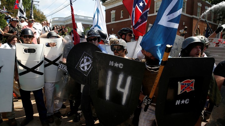 White supremacists stand behind their shields at a rally in Charlottesville, Virginia.