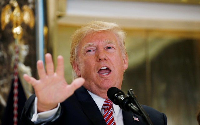 President Trump speaks to reporters at a press briefing.