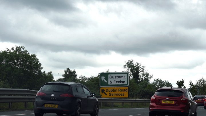 A sign for customs and excise is seen on the motorway approaching the border between Northern Ireland and Ireland on July 13, 2017.