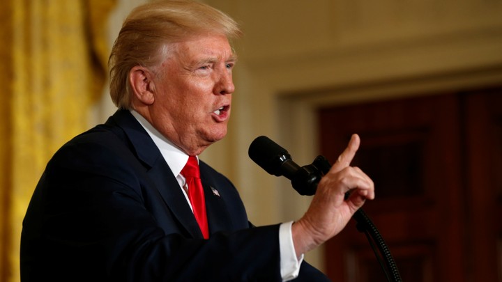 Donald Trump talks to reporters.