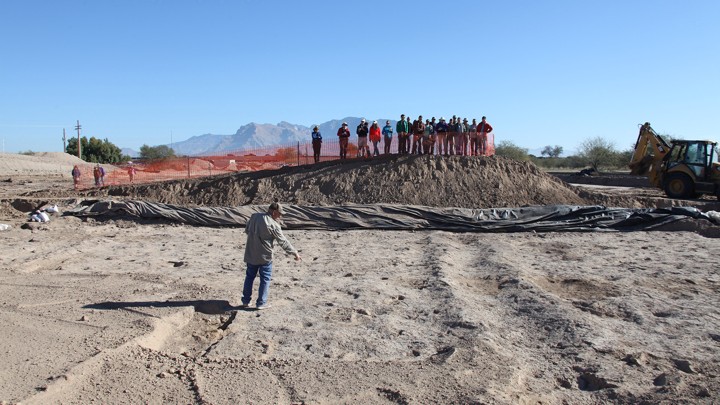 Dan Arnit pointing out the footprints that he first found when excavating with a backhoe