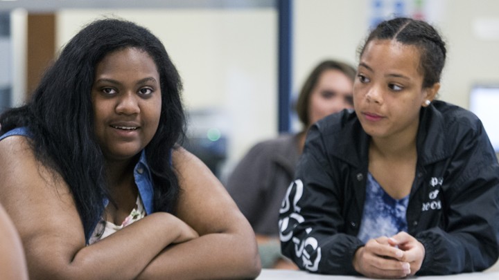 One student talks and another looks at her