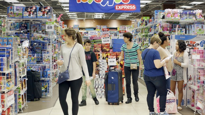 Customers shopping at Toys R Us