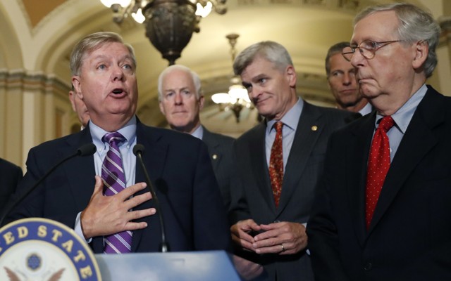 Senate Republicans address reporters at a press conference.