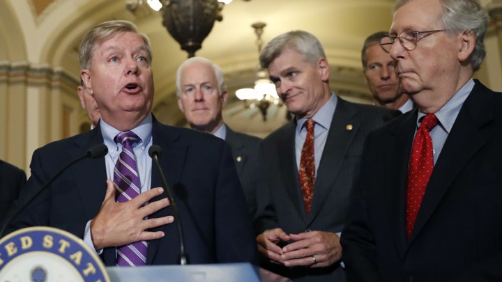 Senate Republicans address reporters at a press conference.