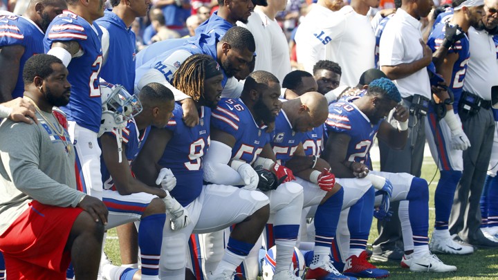 Buffalo Bills players take a knee