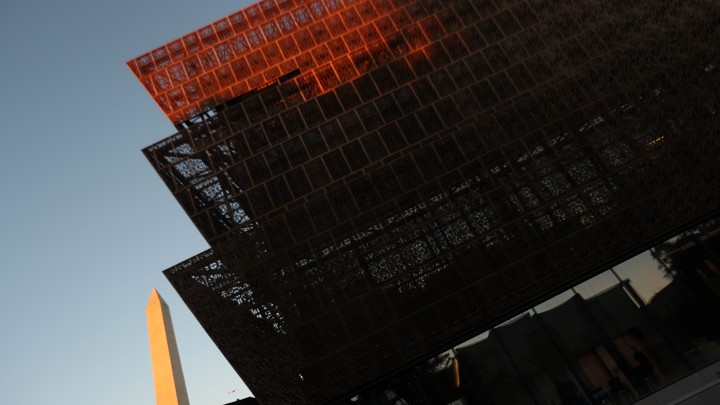 The Smithsonian's National Museum of African American History and Culture with the Washington Monument in the background