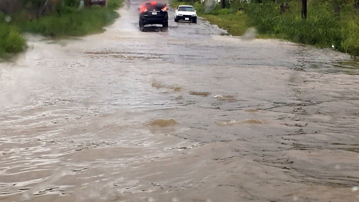 Two cars are blocked by floodwaters from Hurricane Irma in St. John's, Antigua and Barbuda.