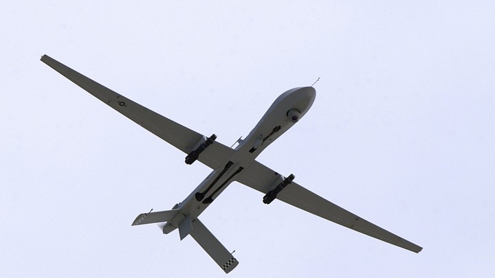 A close-up photo of a drone flying through the sky