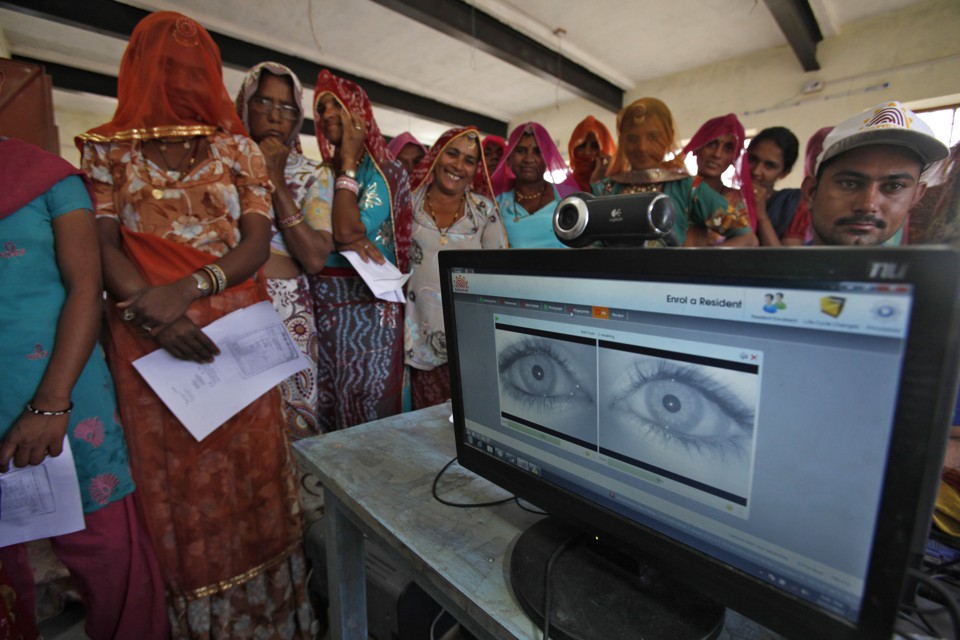 Women stand in a line to enroll in the Unique Identification (UID) database system at Merta district in the desert Indian state of Rajasthan February 22, 2013. 