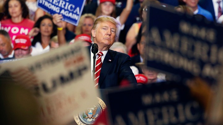 The president peers into the crowd at a campaign rally in August in Arizona.