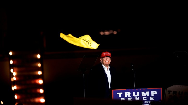Donald Trump throws a Pittsburgh Steelers "Terrible Towel" at a rally in Pennsylvania in November 2016.