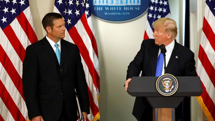 Kris Kobach and President Trump at a meeting in July