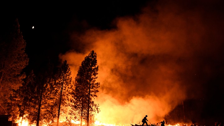A firefighter battles the Ponderosa Fire east of Oroville, California, in late August.