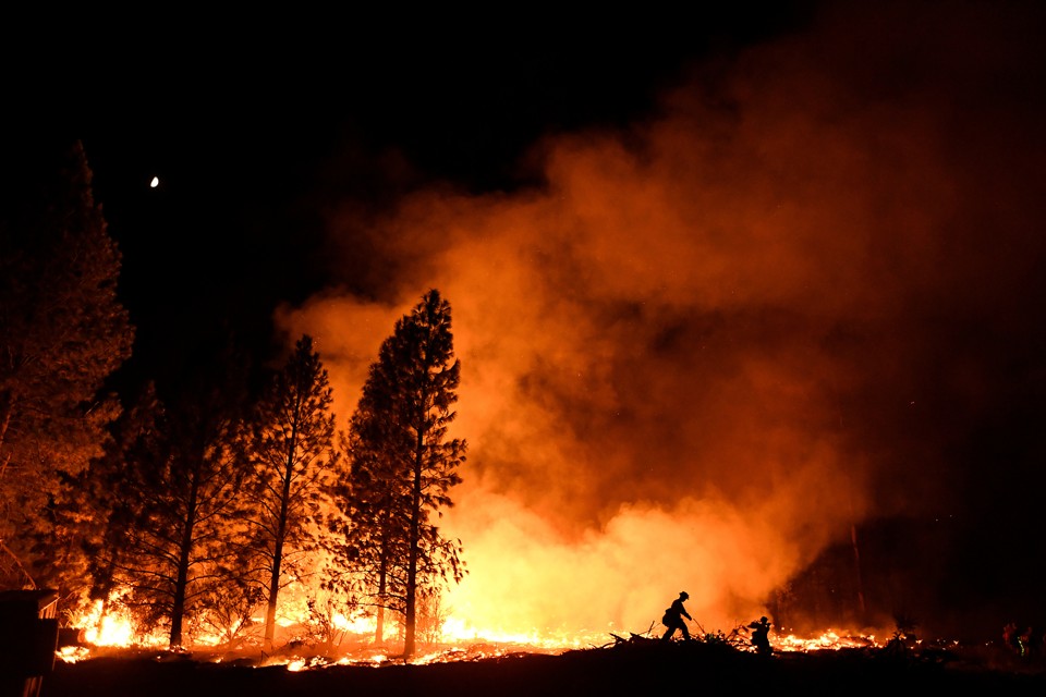 A firefighter battles the Ponderosa Fire east of Oroville, California, in late August.