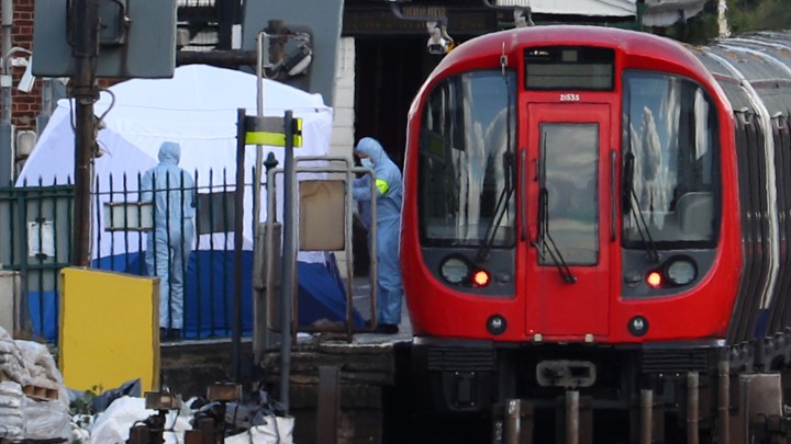 Authorities search the Parsons Green tube station platform in London following an explosion on September 15, 2017.