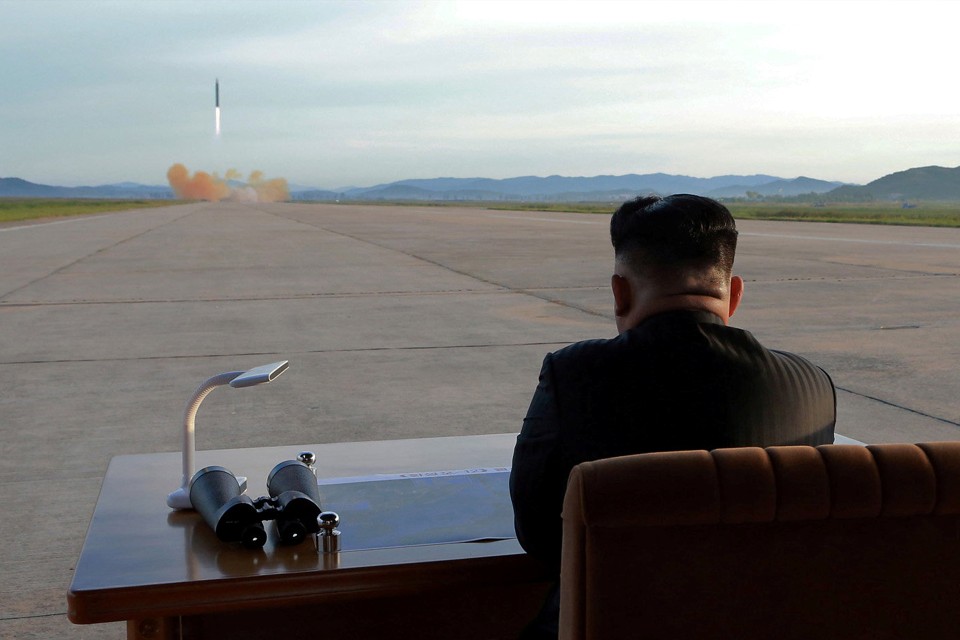 Kim Jong Un watches the launch of a Hwasong-12 missile. 