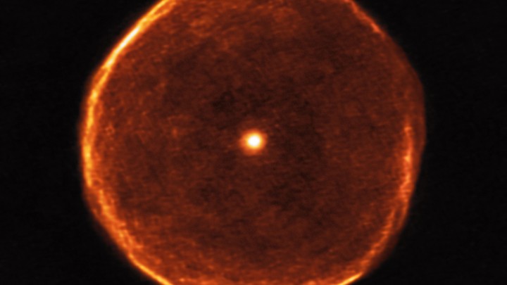 A large glowing red star that appears to have a red bubble around it