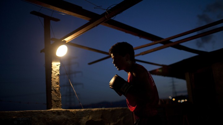 A boy wearing a boxing glove