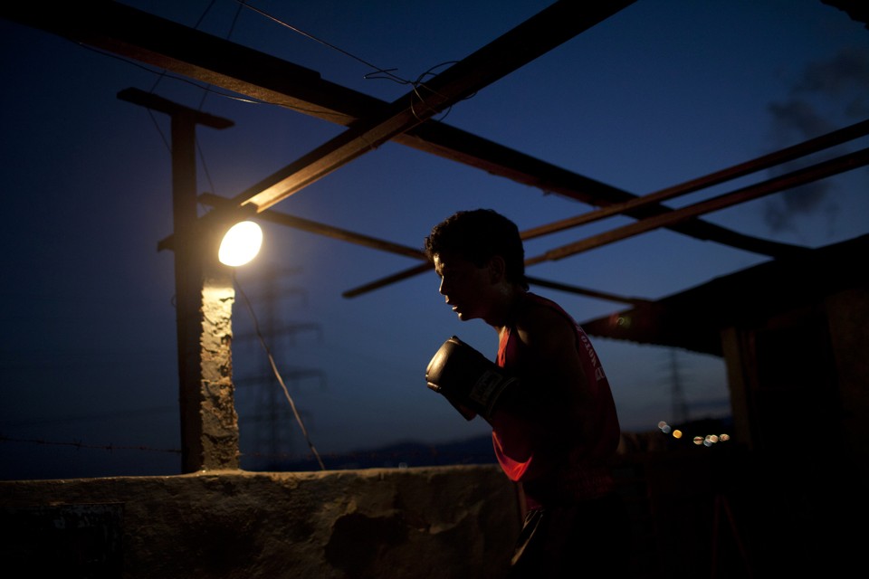 A boy wearing a boxing glove