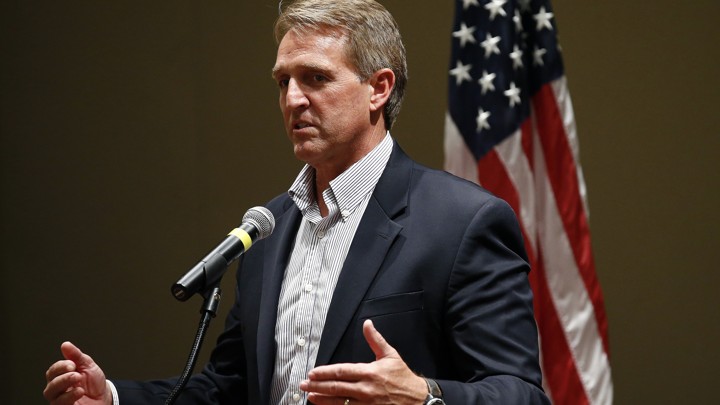 Senator Jeff Flake speaking into a microphone