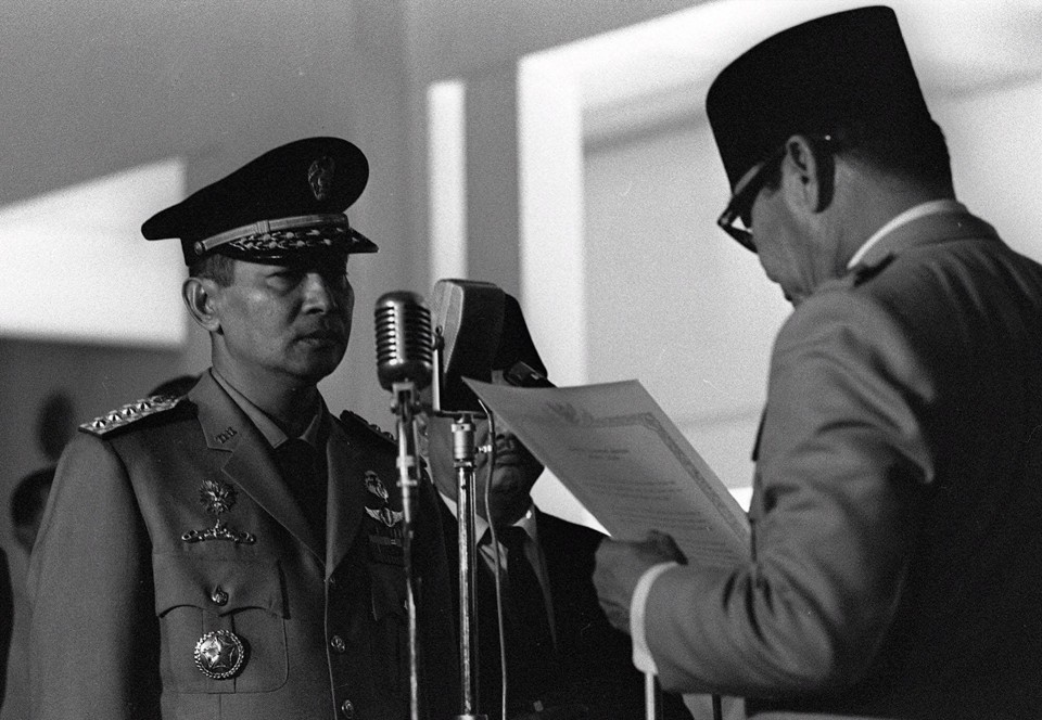 General Suharto being sworn into the Indonesian Cabinet by President Sukarno