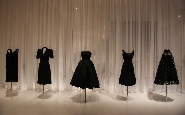 Little black dresses on display on mannequins
