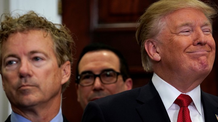 Trump smirks next to Rand Paul.
