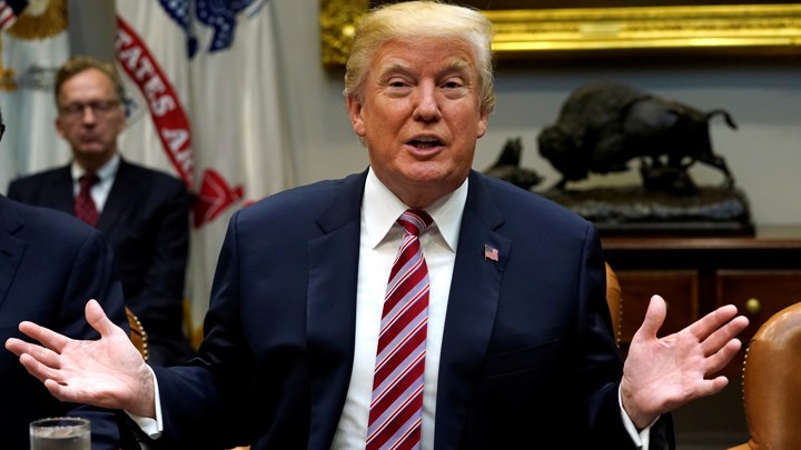 President Trump gestures as he talks.
