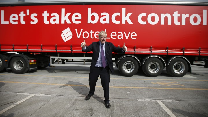 London Mayor Boris Johnson gestures in front of a Leave campaign bus