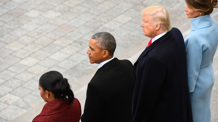 Michelle Obama, Barack Obama, Donald Trump, and Melania Trump stand together.