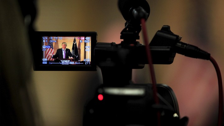 The president being filmed through a video camera