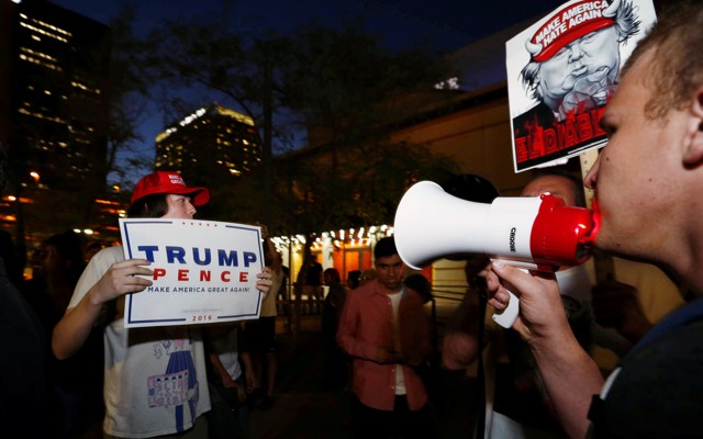 Pro- and anti-Trump protestors square off outside a rally in Arizona in August.