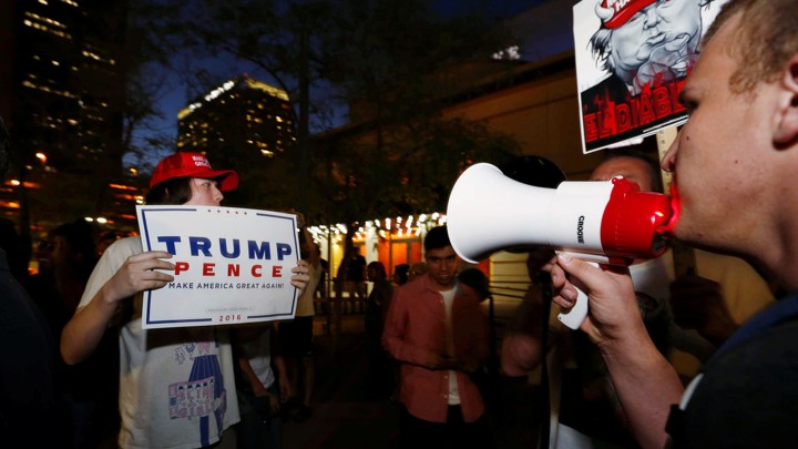 Pro- and anti-Trump protestors square off outside a rally in Arizona in August.
