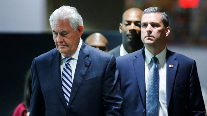 Secretary of State Rex Tillerson exits a meeting.