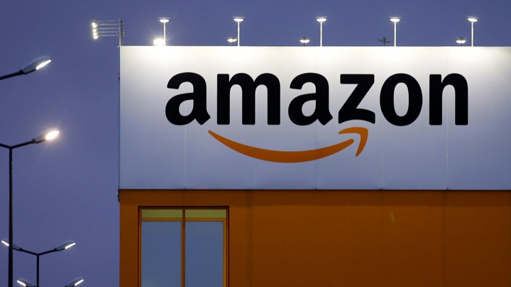 An Amazon billboard on a storefront.