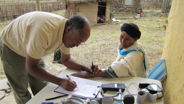 The researcher Dawit Wolde Meskel takes a skin-reflectance reading.