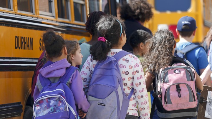Students board a bus.