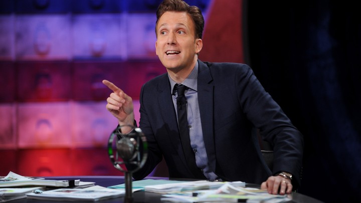 Jordan Klepper, the host of 'The Opposition,' at his desk