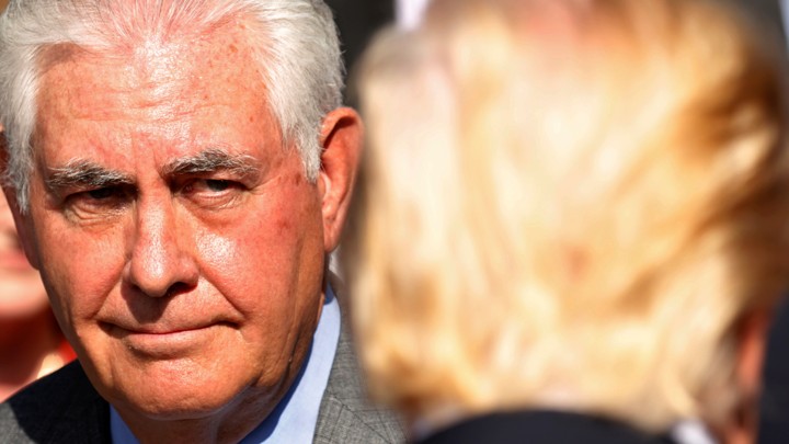U.S. Secretary of State Rex Tillerson looks toward President Donald Trump.