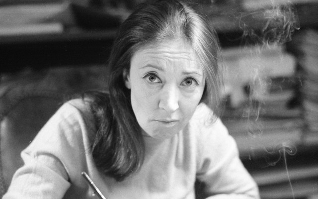 Oriana Fallaci smoking a cigarette.