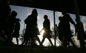 Students walk on campus in the morning.