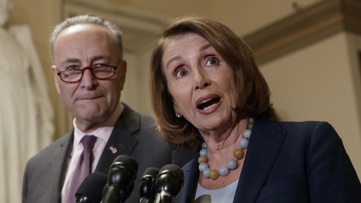 Senate Minority Leader Chuck Schumer and House Minority Leader Nancy Pelosi with microphones