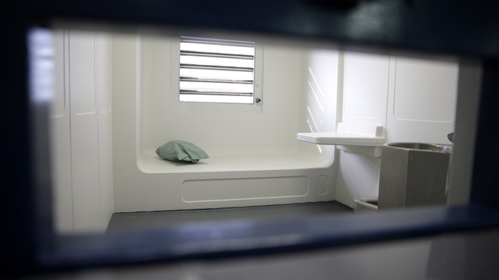 A jail cell in an enhanced supervision housing unit on Rikers Island, seen through a slot in the door